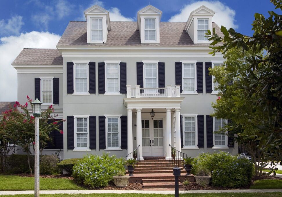 Two story colonial style home with shutters